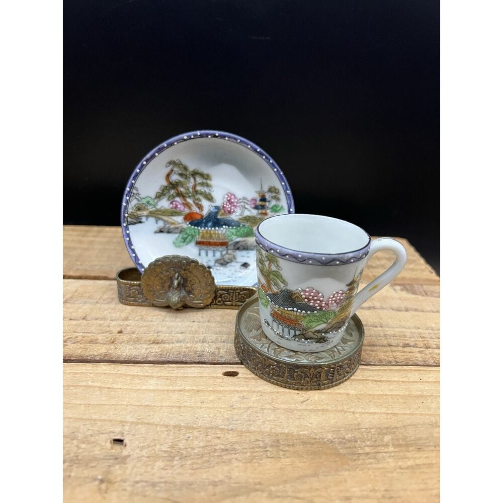 Japanese Kutani Porcelain cup and saucer With Brass Peacock Display Stand